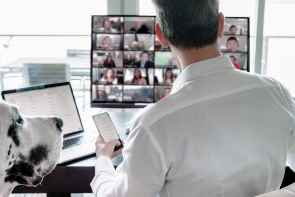 man working remotely multitasking video chatting 2021 08 29 15 41 56 utc scaled